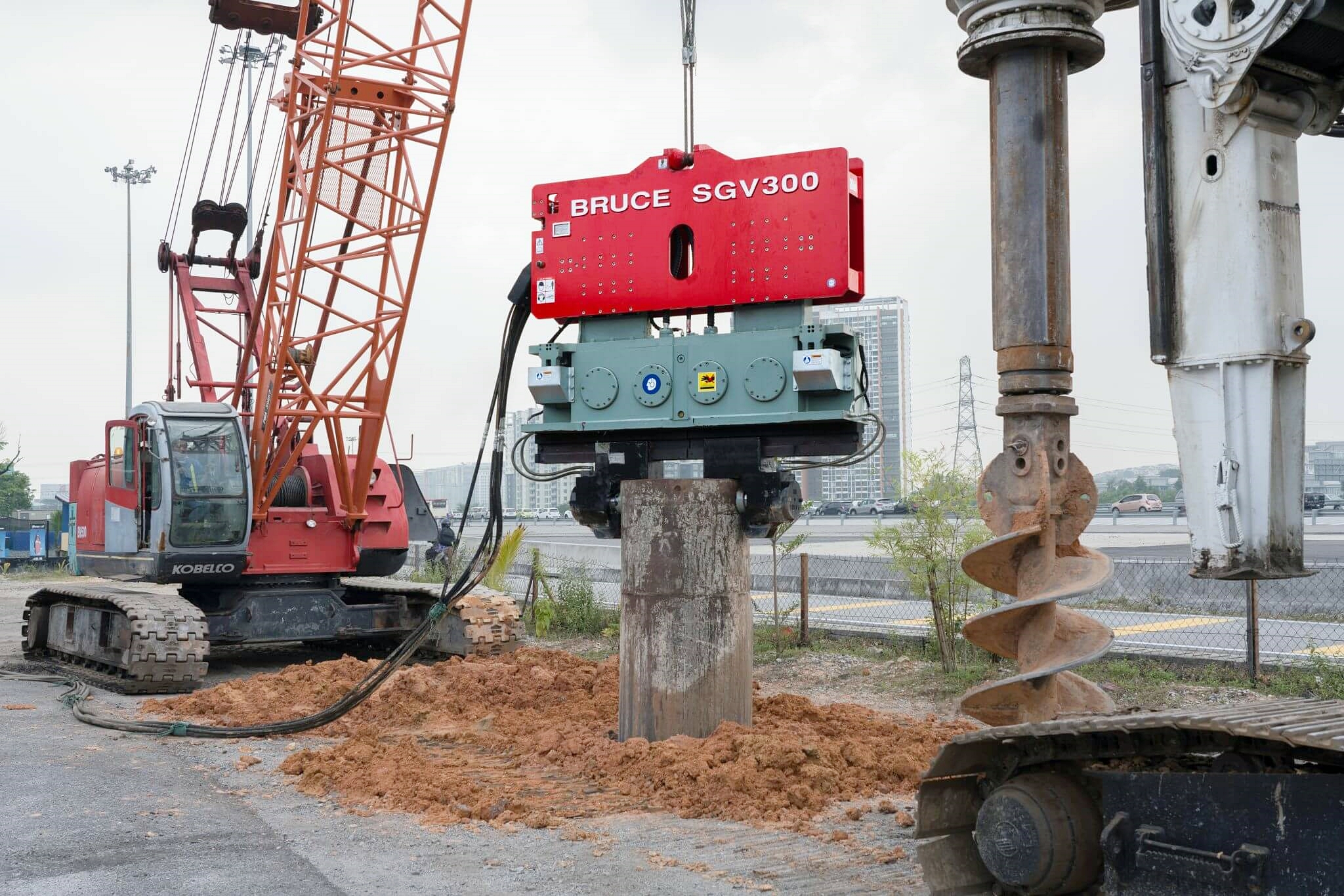 BRUCE vibratory hammer driving sheet piles into soil 