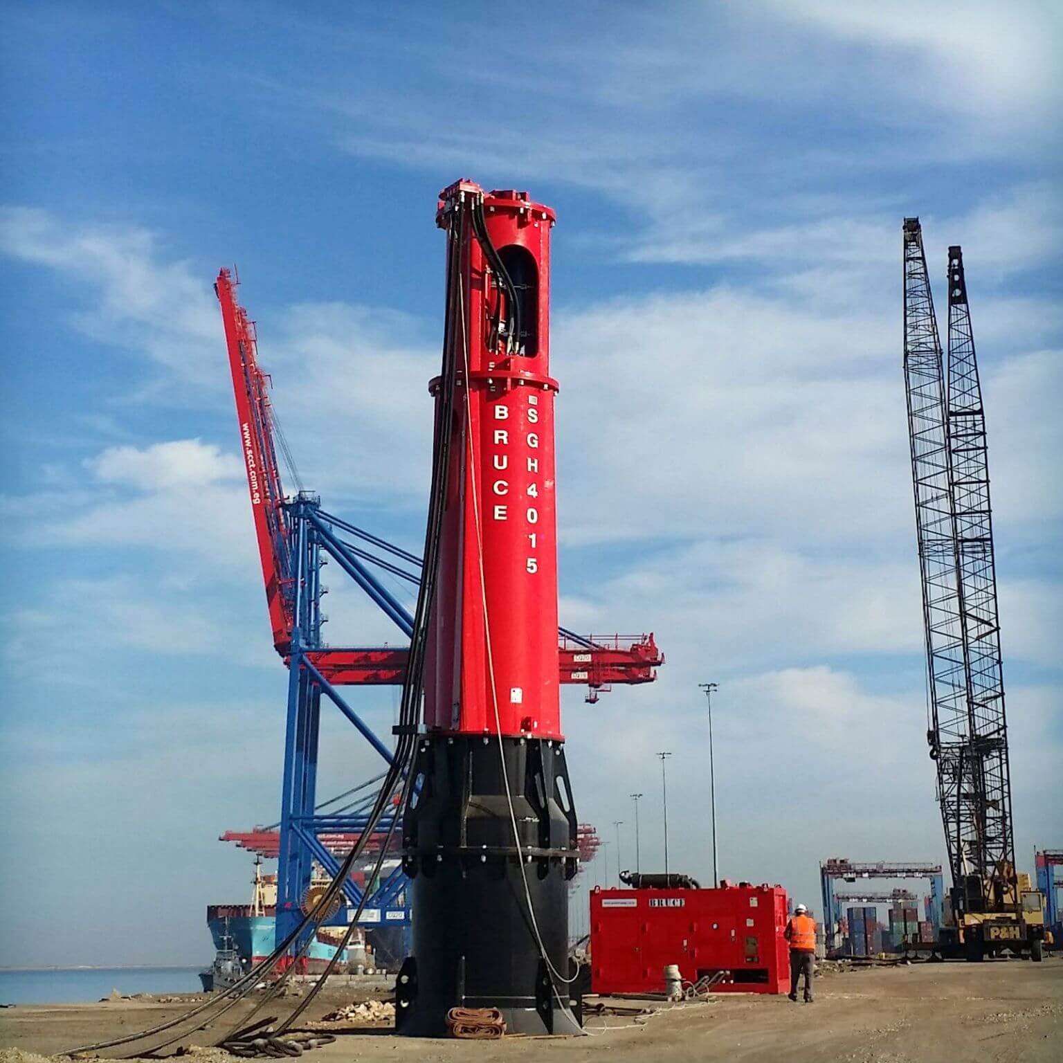 BRUCE hydraulic piling hammer driving steel pile at offshore construction site