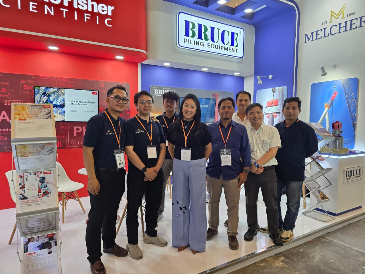 Group photo at the BRUCE Piling Equipment booth at ADEXCO 2026 in Jakarta